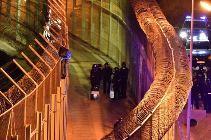 Hundreds of migrants try to storm border into Spain`s enclave of Ceuta 